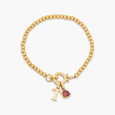 Pulsera con dije de inicial con piedra de nacimiento y cuentas