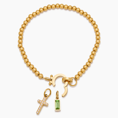 Pulsera con dije de cruz y cuentas de piedra de nacimiento